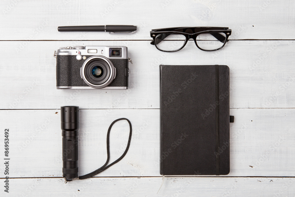 Set of reading glasses  and cool stuff on wooden table