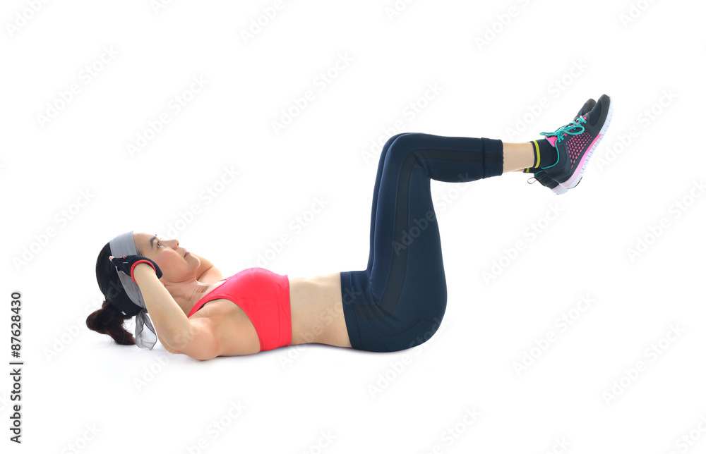 Middle aged woman exercising isolated on white background