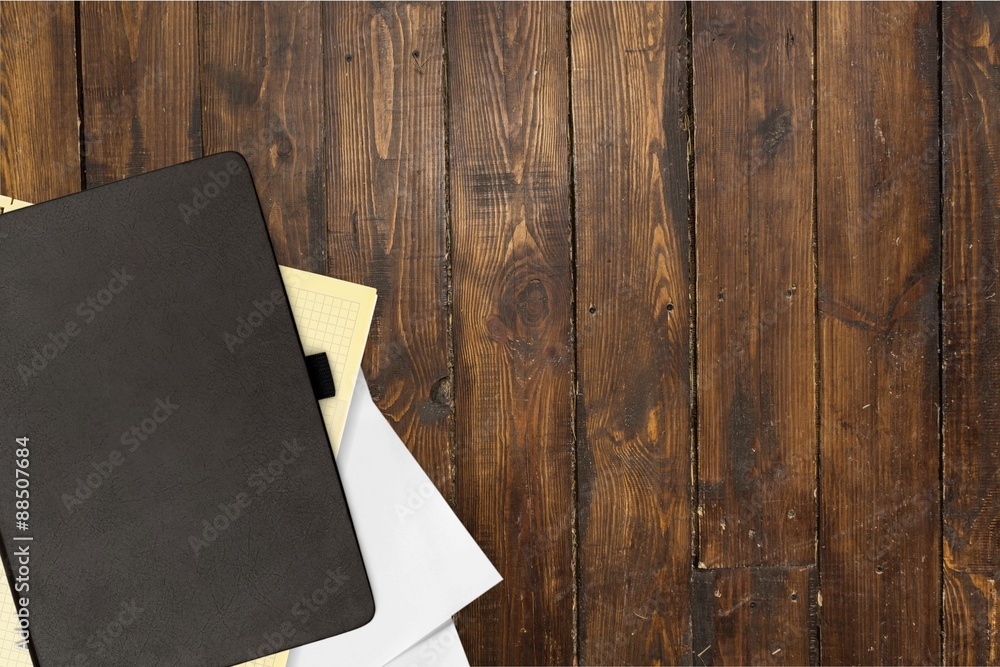 Desk, wooden, book.