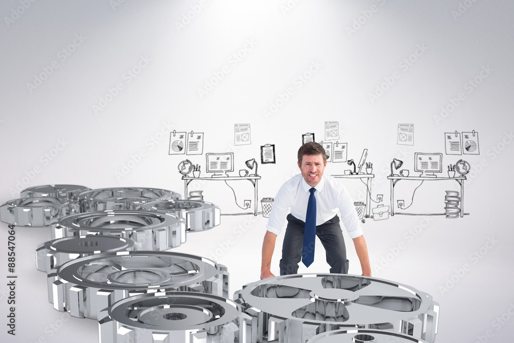 Composite image of businessman bending and lifting