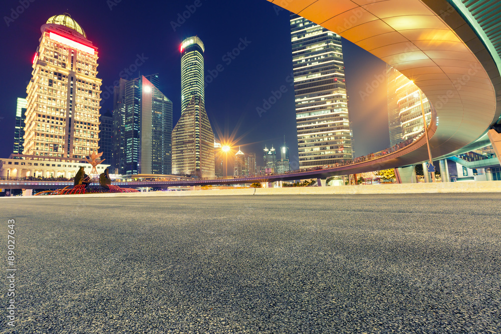 Urban asphalt road and modern architecture at night，in Shanghai ,China