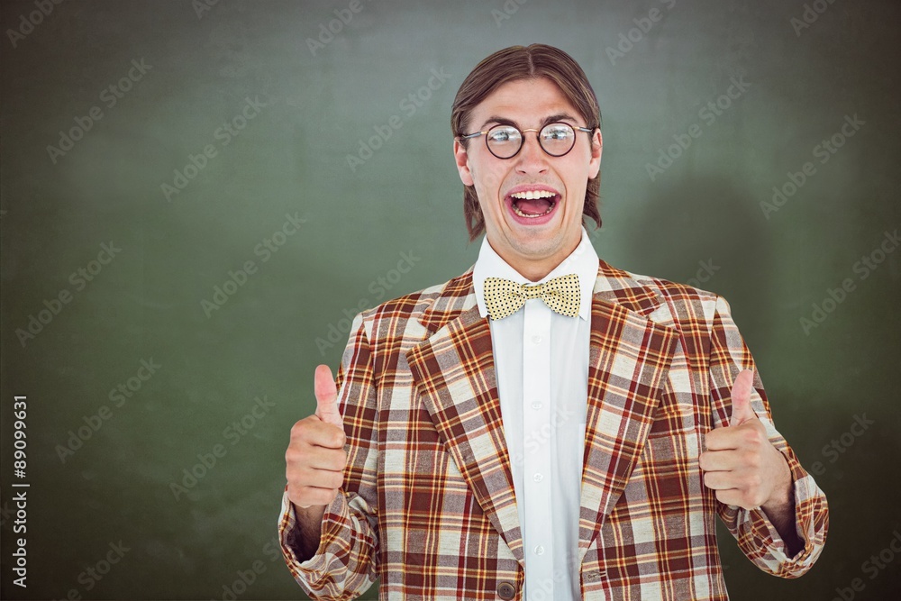 Composite image of smiling geeky hipster smiling at camera