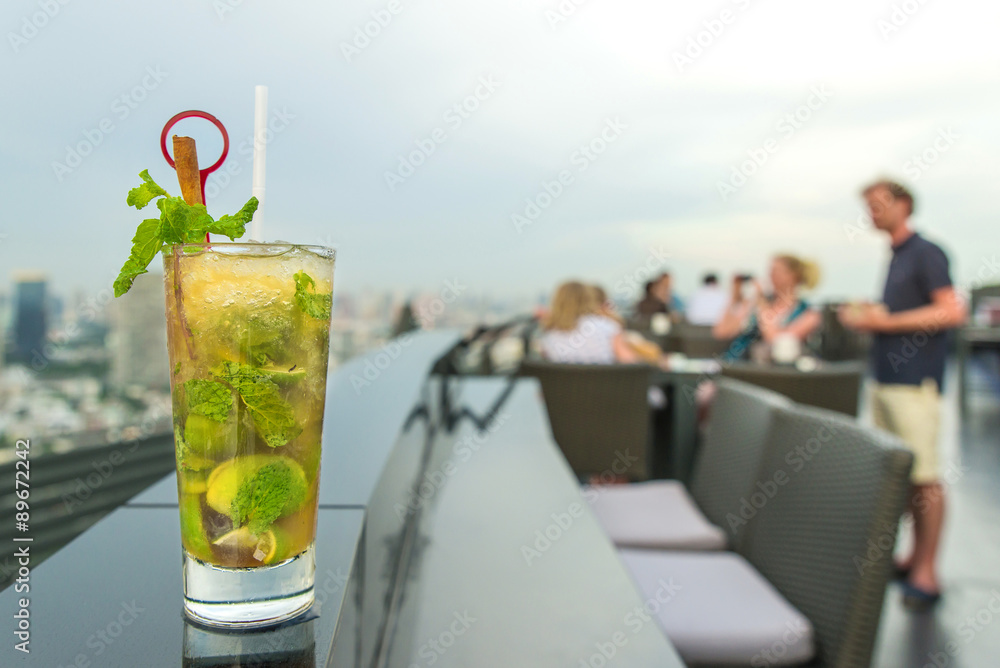 Mojito cocktail on table in rooftop bar