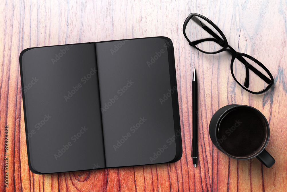 Black blank diary with cup of coffee and glasses