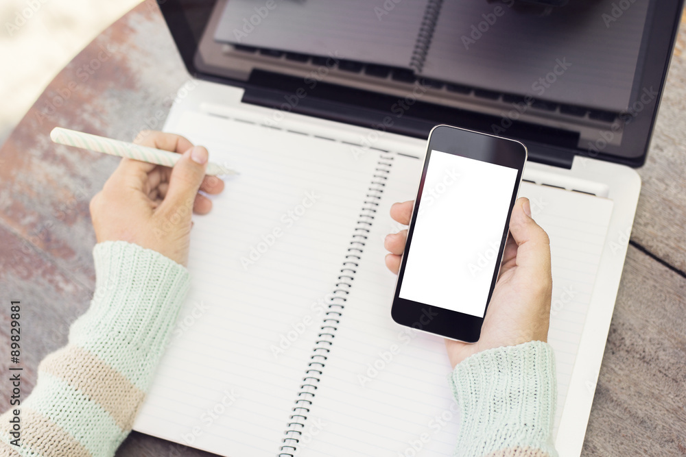 Girl with blank cell phone and diary, mock up