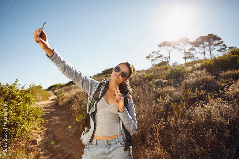 Young woman hiker a selfie in nature