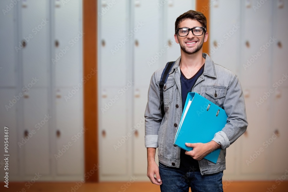 Composite image of student smiling at camera in library