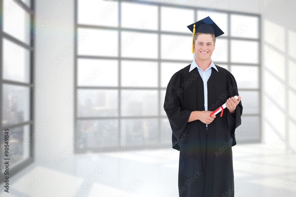 Composite image of a male graduate with his degree in hand