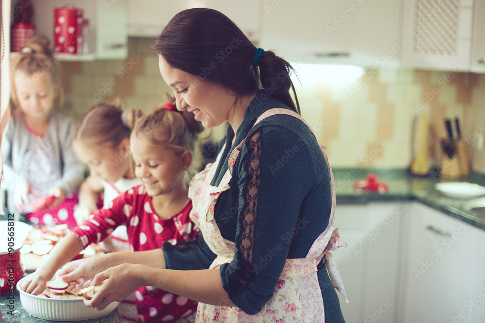 Mother with kids at the kitchen