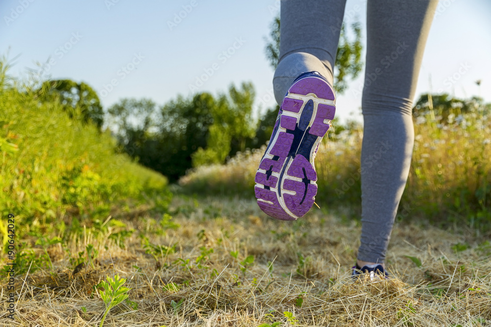 Woman running in a field