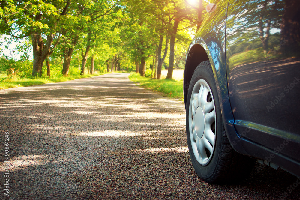 Car on asphalt road in summer