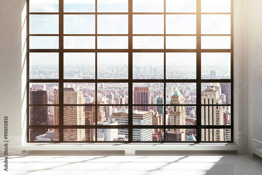 Empty loft interior with city view