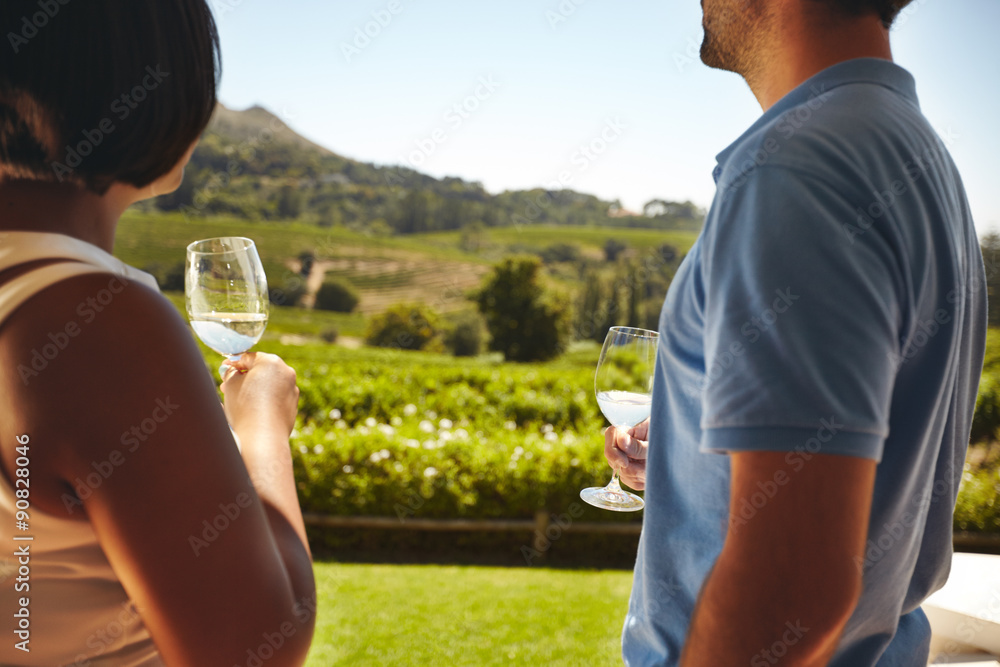 Couple at winery with glass of white wine