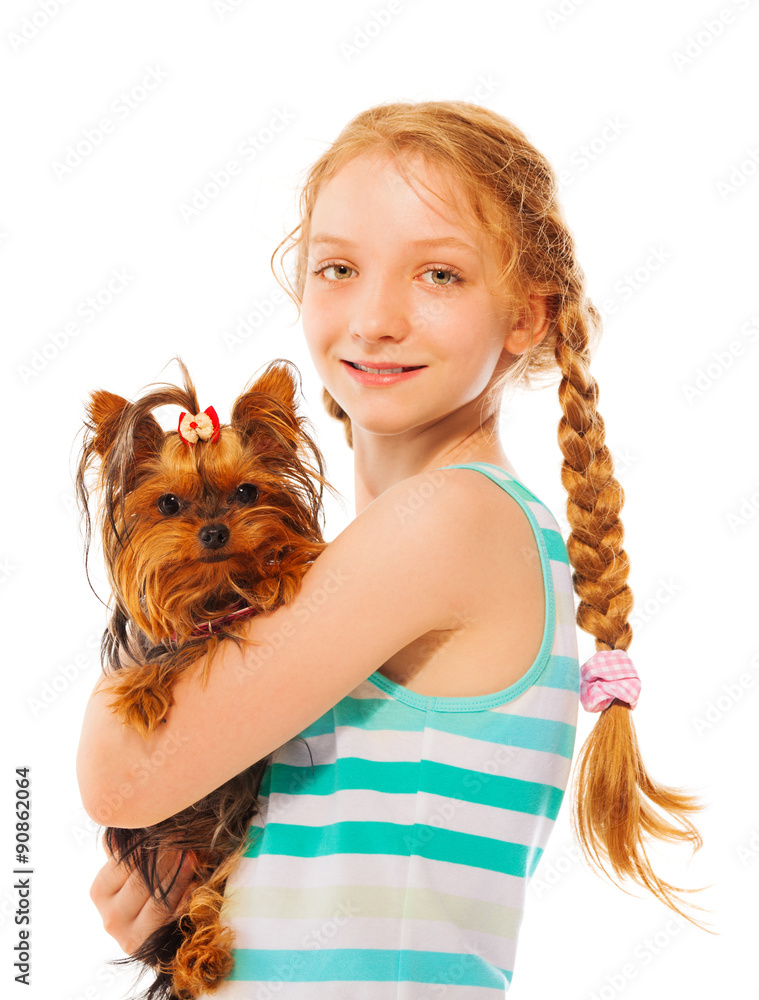 Serious smiling girl holding little cute dog 