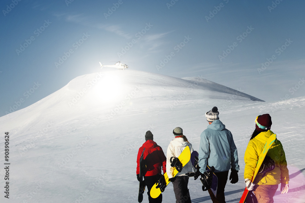 Group of snowboarders enjoying a beautiful Winter morning Concep