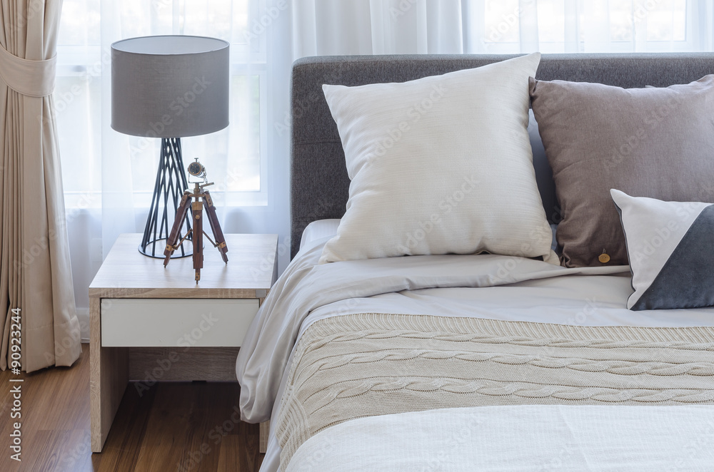 modern bedroom with lamp on white table side