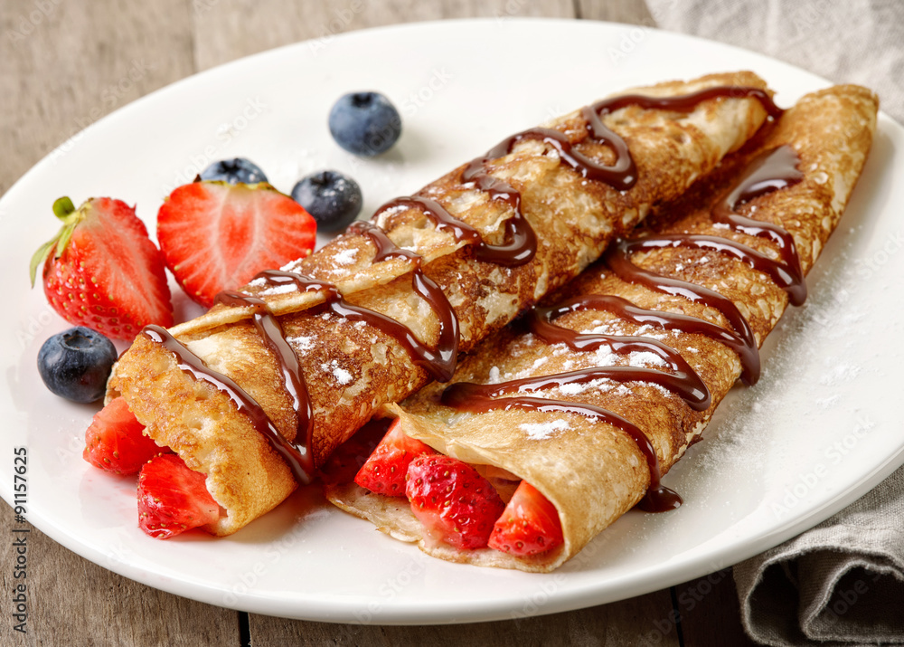 Crepes with strawberries and chocolate