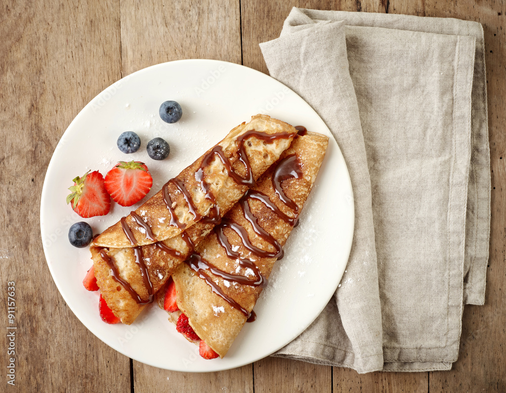 Crepes with strawberries and chocolate