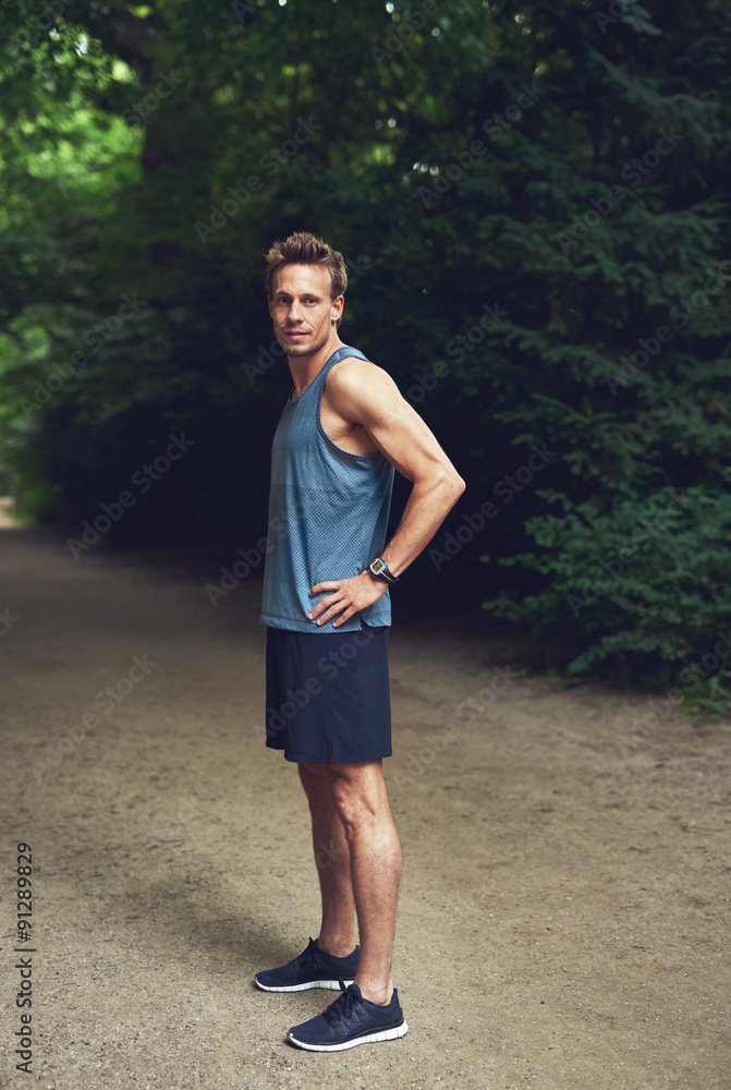 Muscular Young Man Standing at the Park