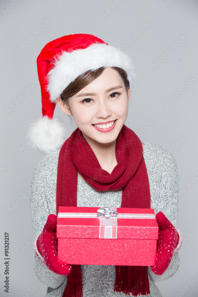 A woman delivers christmas gift