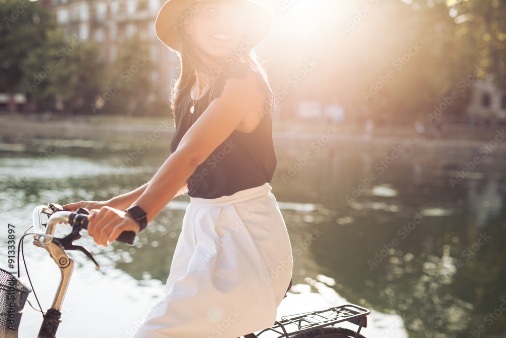 Woman cycling on a summer day