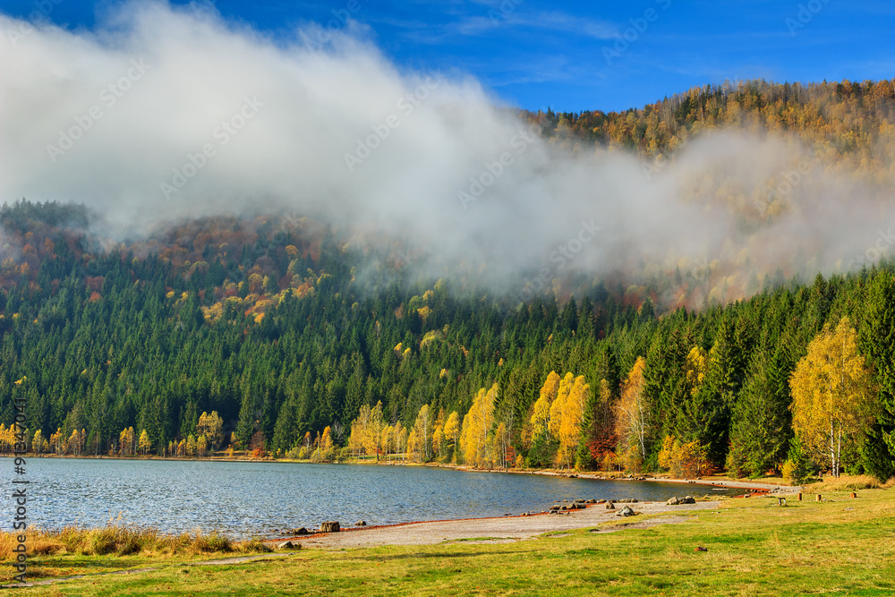 Stunning foggy autumn landscape with Saint Anna Lake,Transylvania,Romania