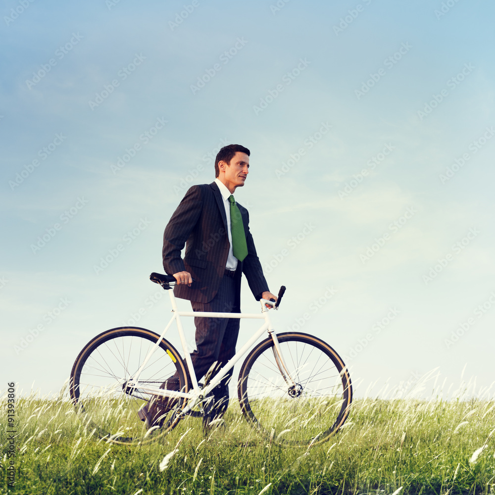 Business Man Pushing Bike Outdoors Concept