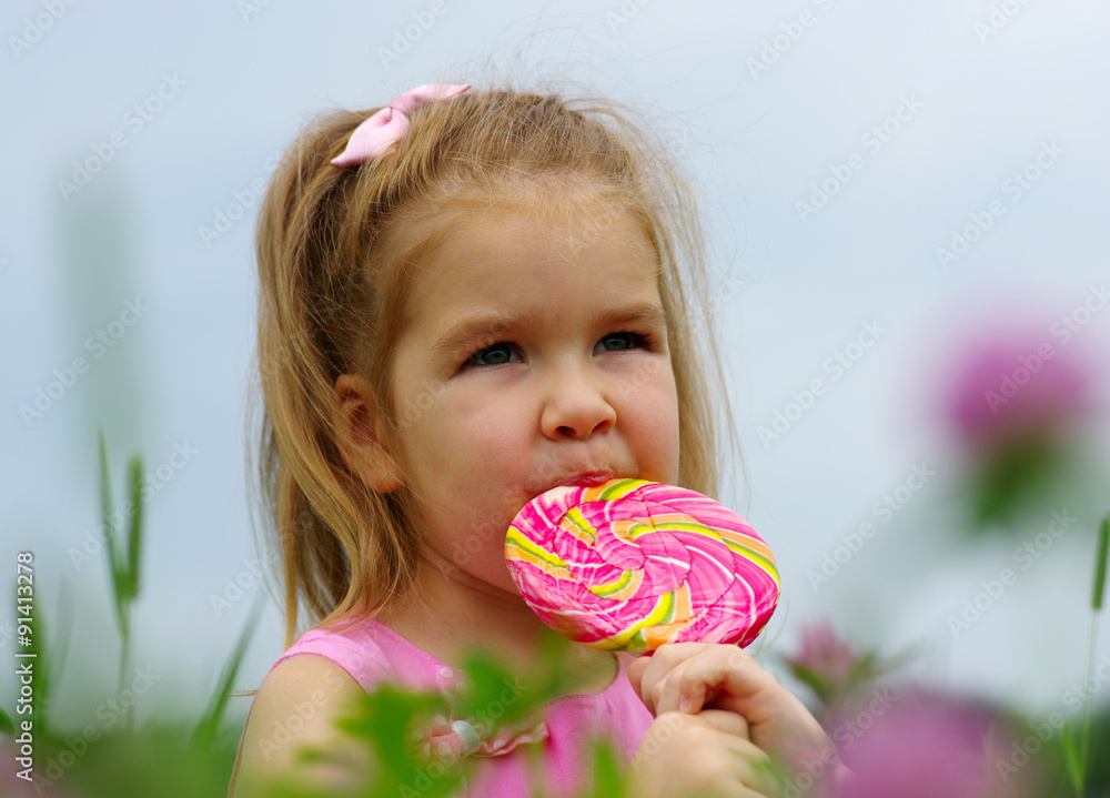  girl eating a lollipop