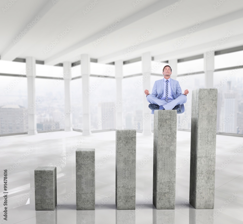 Composite image of calm businessman meditating in lotus pose