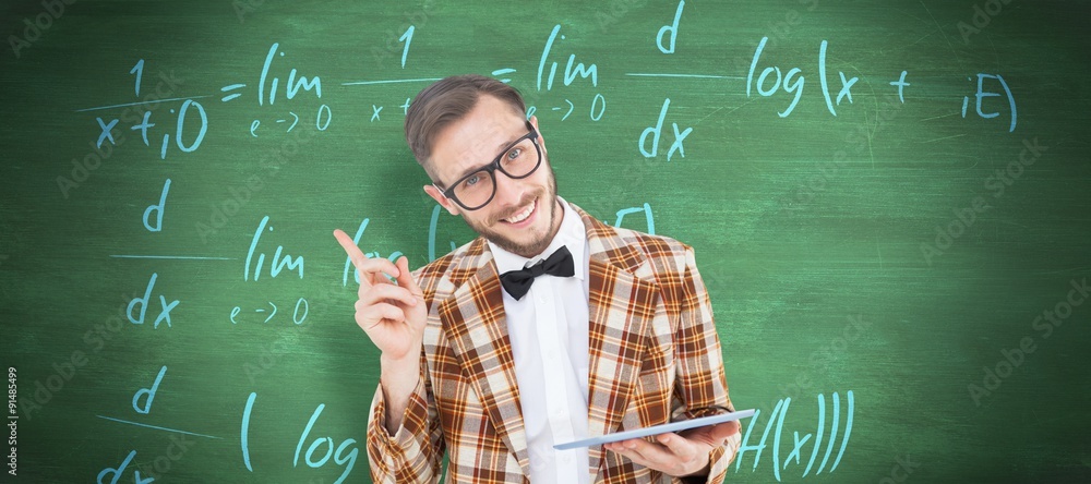 Composite image of geeky hipster holding a tablet pc