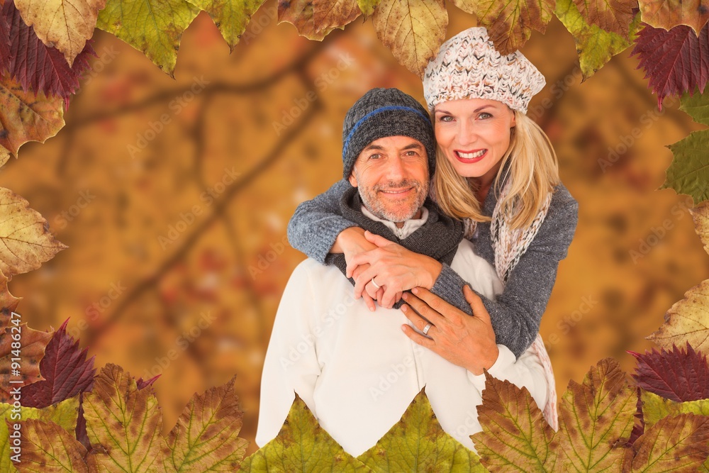 Composite image of portrait of wife embracing husband