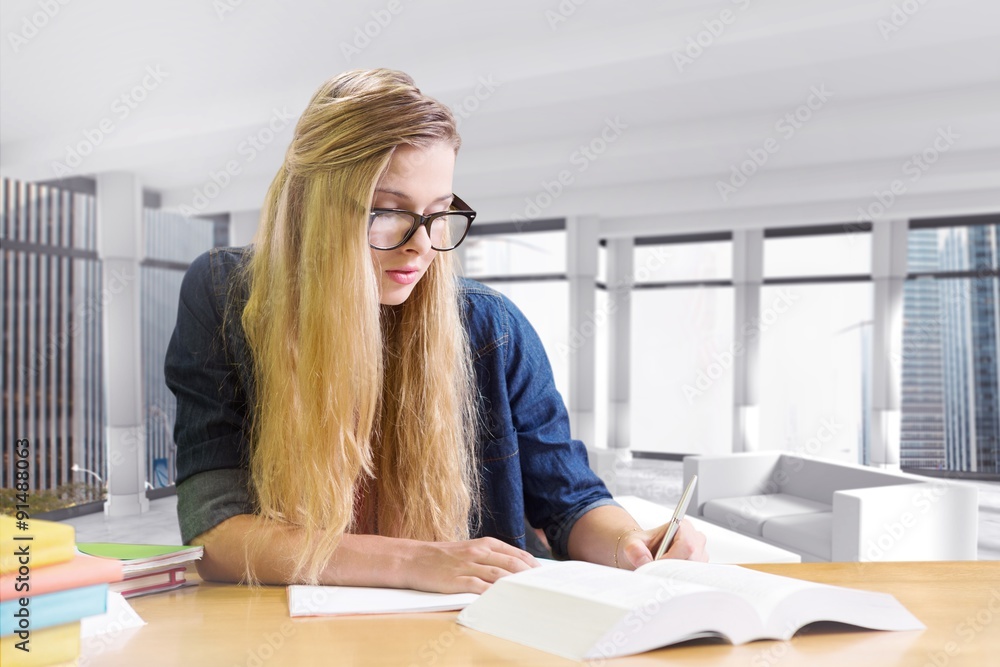 Composite image of student studying in the library 