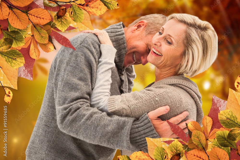 Composite image of happy mature couple in winter clothes