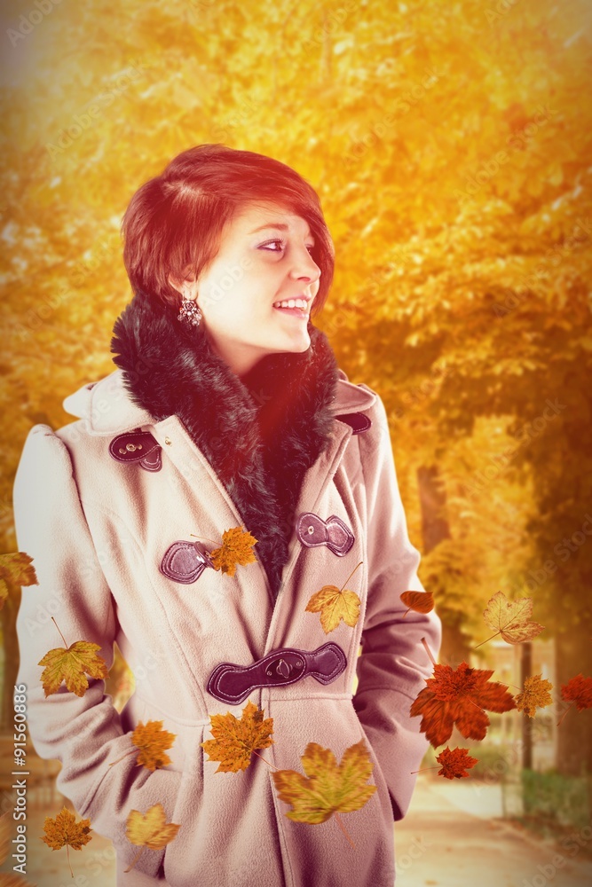 Composite image of smiling beautiful woman in winter coat