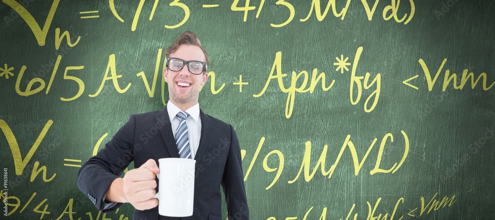 Composite image of happy geeky businessman holding coffee mug