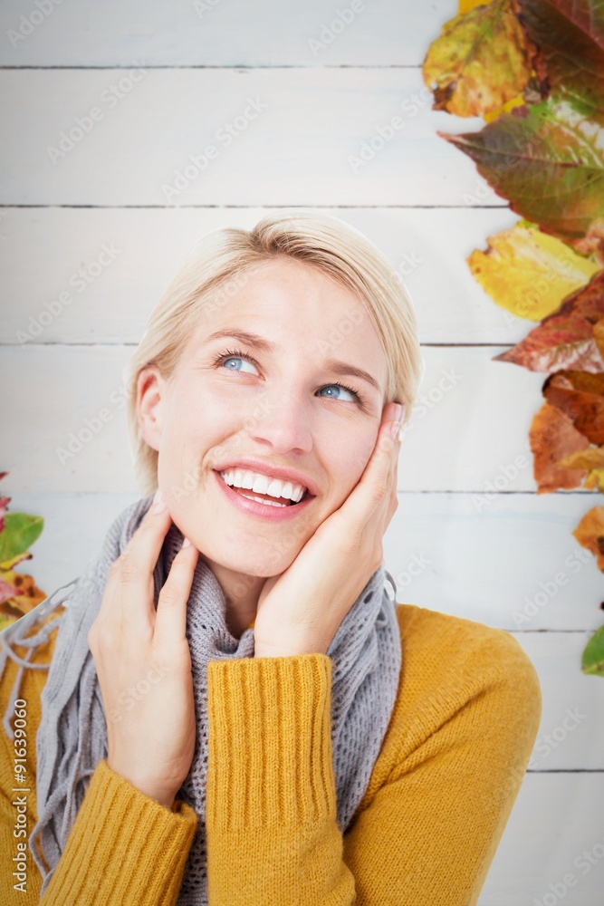 Composite image of smiling woman wearing a scarf