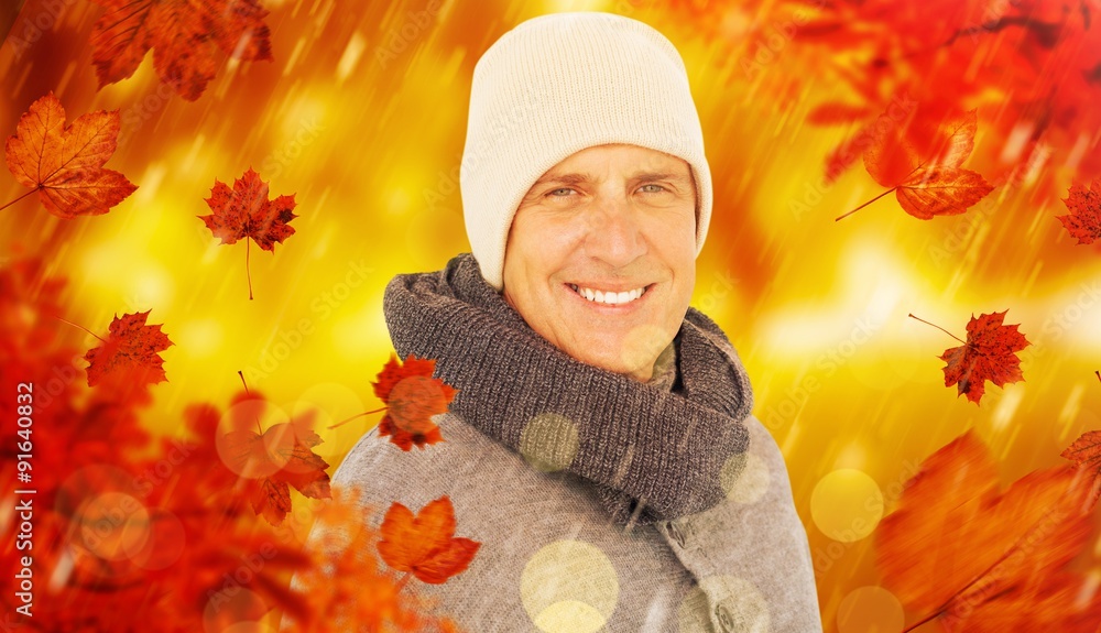 Composite image of casual man in warm clothing