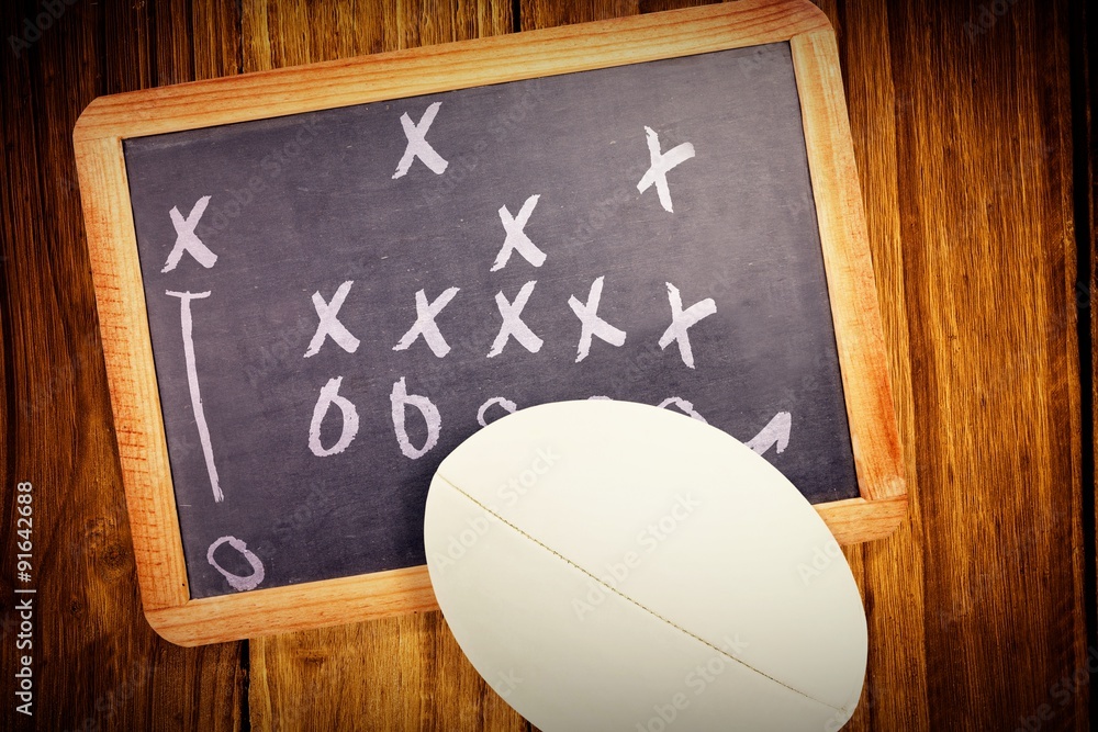 Composite image of close-up of rugby ball