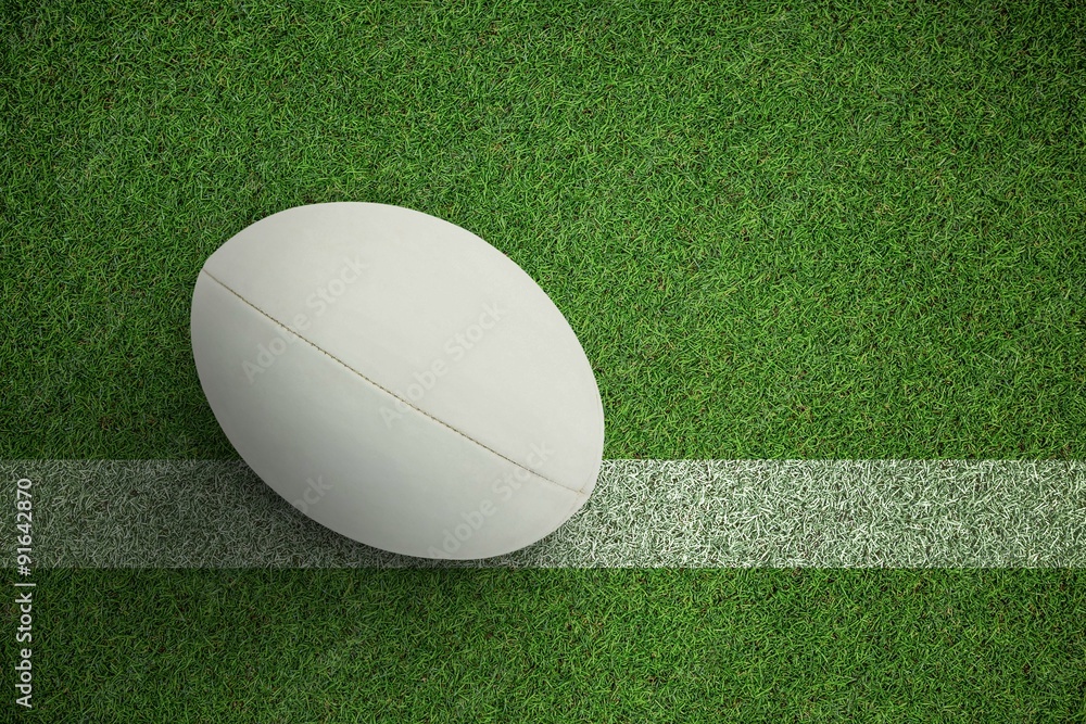 Composite image of close-up of rugby ball