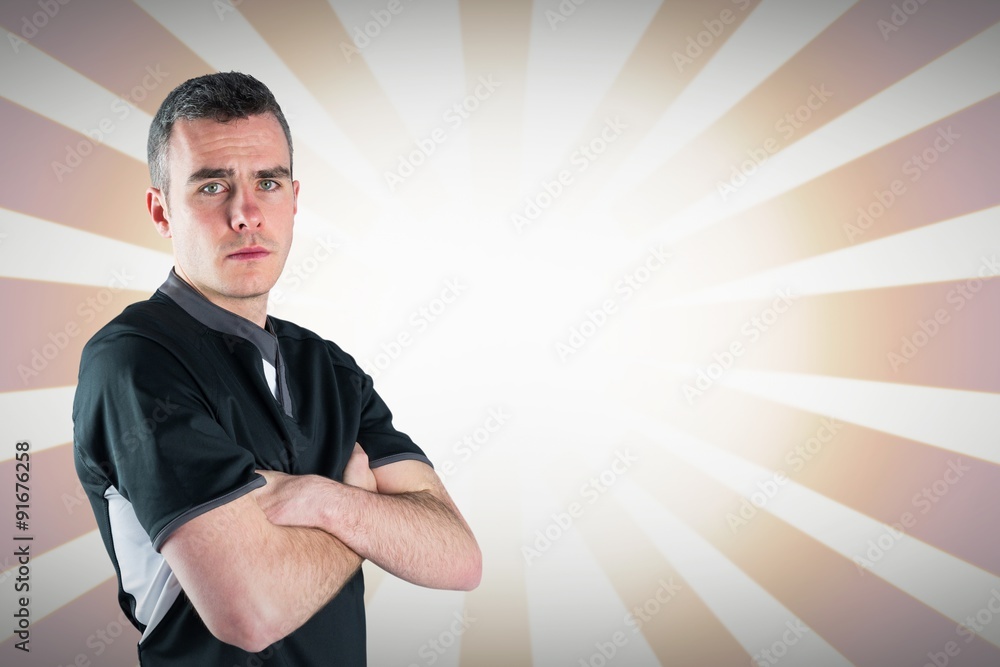 Composite image of rugby player holding a rugby ball