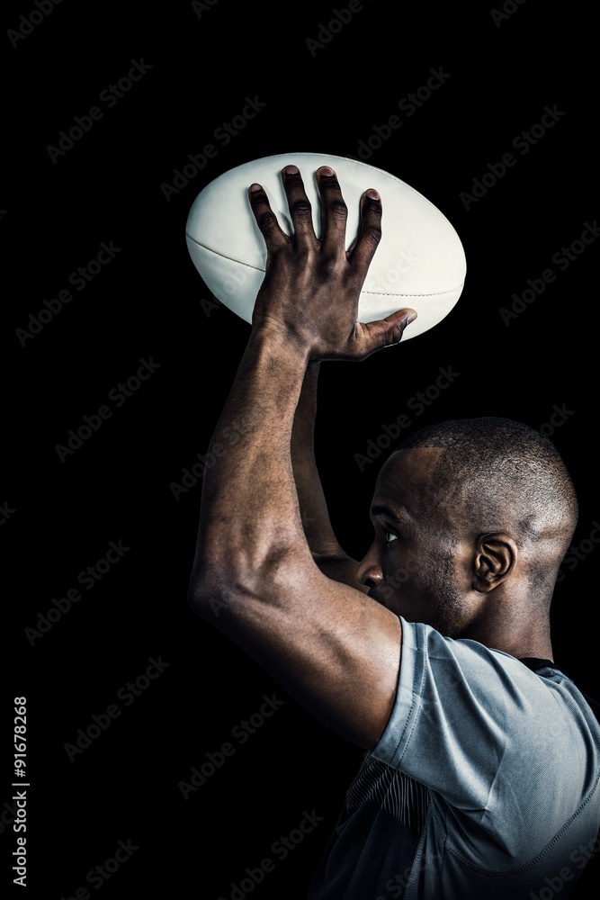 Composite image of rugby player throwing ball