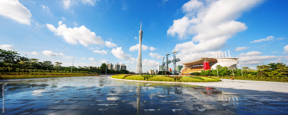 modern square and skyscrapers under blue sky