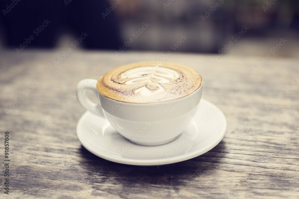 Cup of coffee on a wooden table