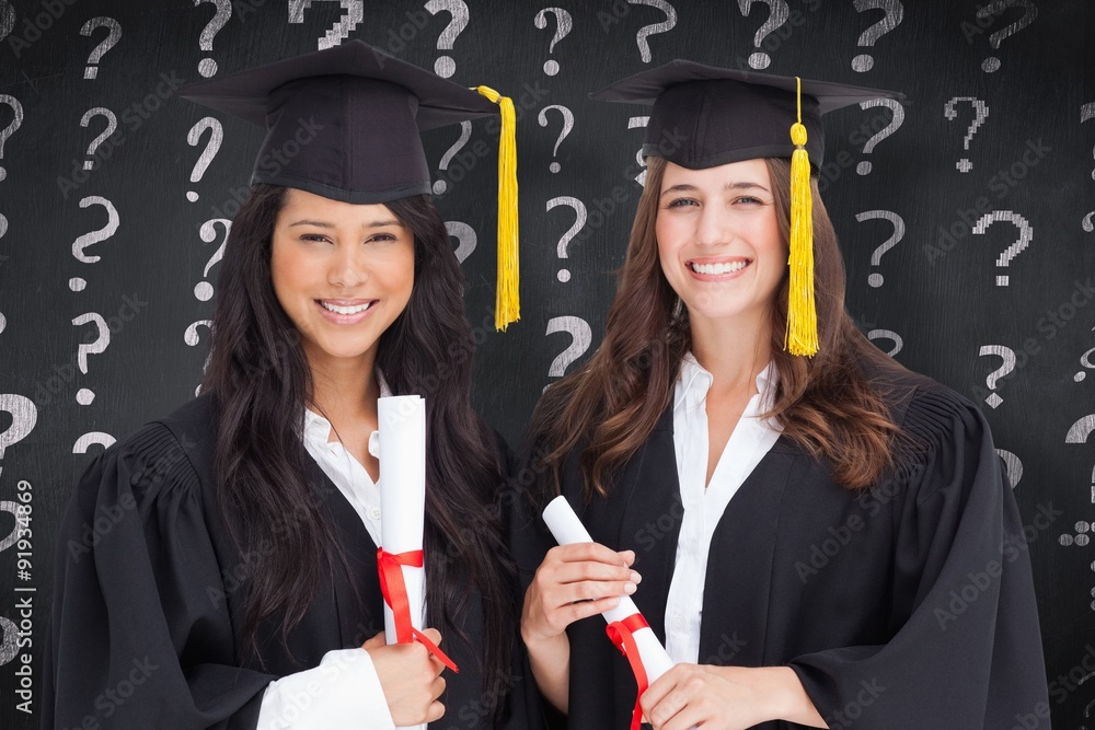 Composite image of two friends stand together after graduating