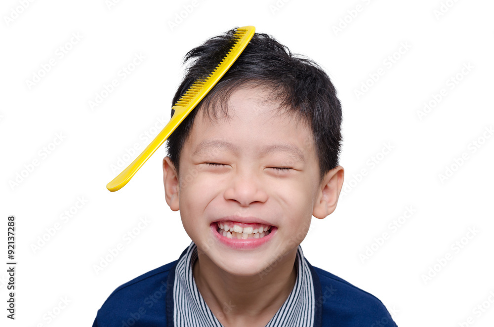 Asian boy smiling with yellow comb on his hair