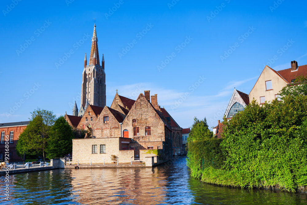 Sunny Church of Our Lady Bruges view from river