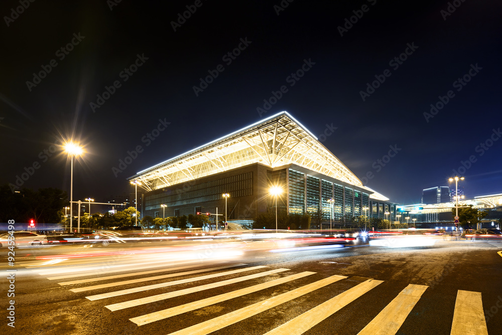 empty road with zebra crossing and gymnasium