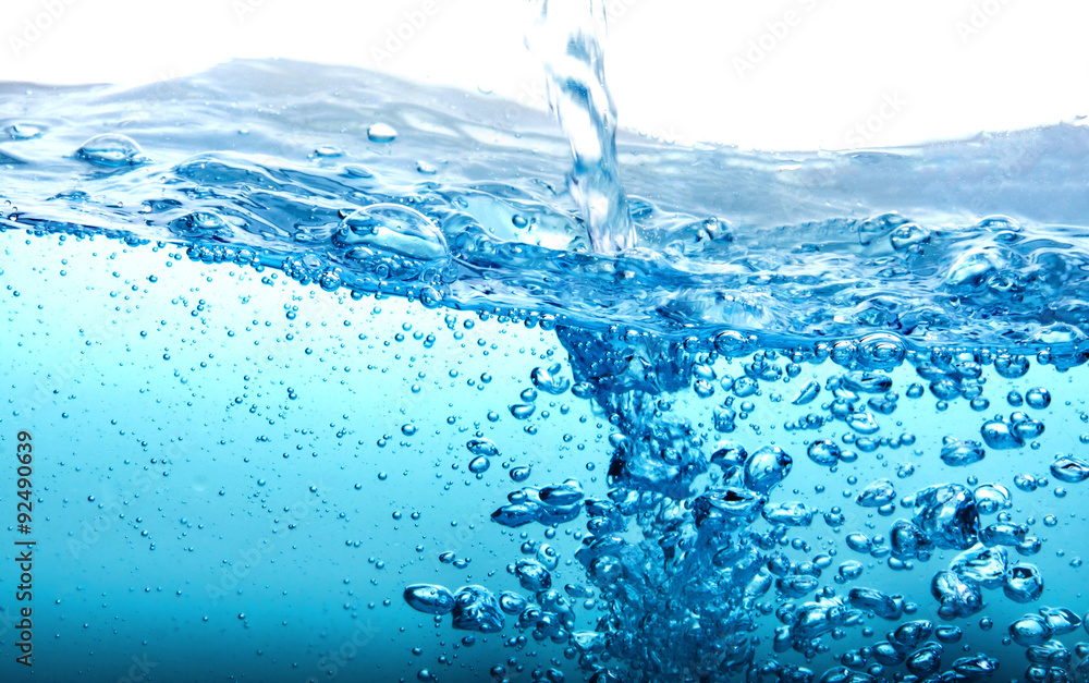 Close up blue Water splash with bubbles on white background