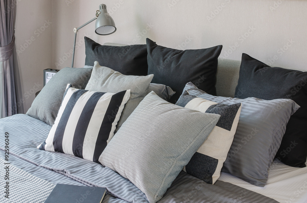 modern bedroom with dark color tone pillows