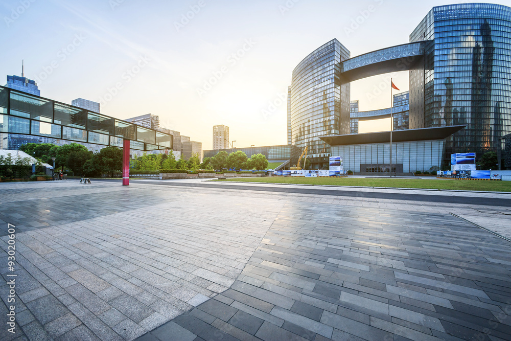 modern square and skyscrapers under sunbeam